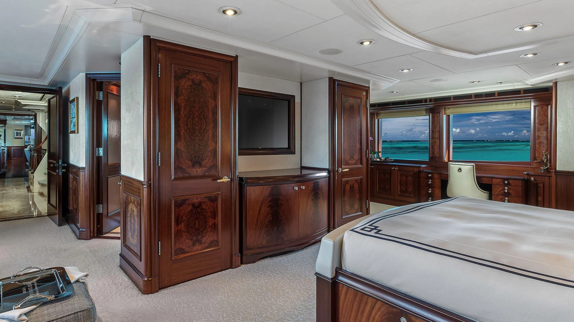 a hotel room with a bed and a television aboard AVALON Yacht for Sale