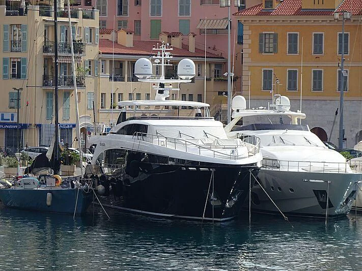 several boats docked in a harbor aboard AVALON Yacht for Sale
