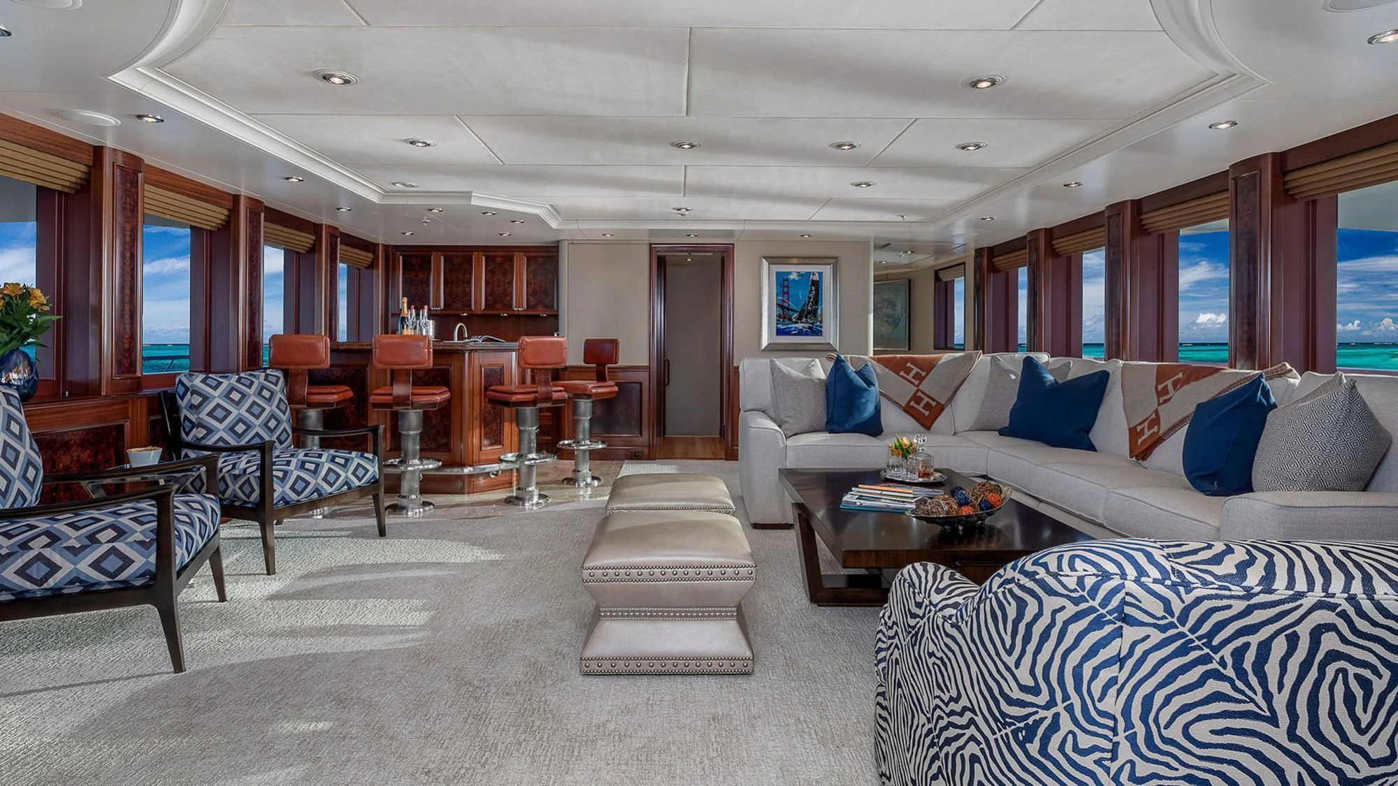 a living room with a couch and a table aboard AVALON Yacht for Sale