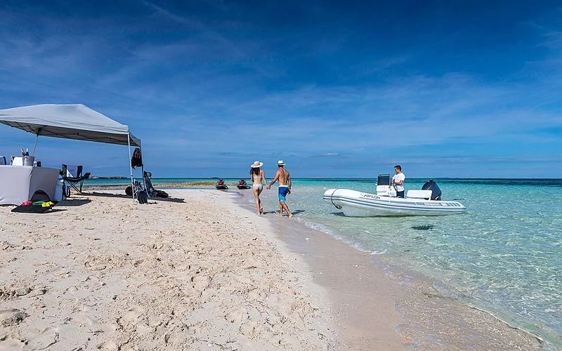 people walking on the beach aboard AVALON Yacht for Sale