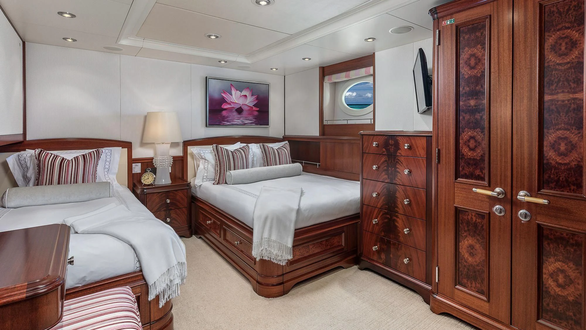 a couple of beds in a hotel room aboard AVALON Yacht for Sale