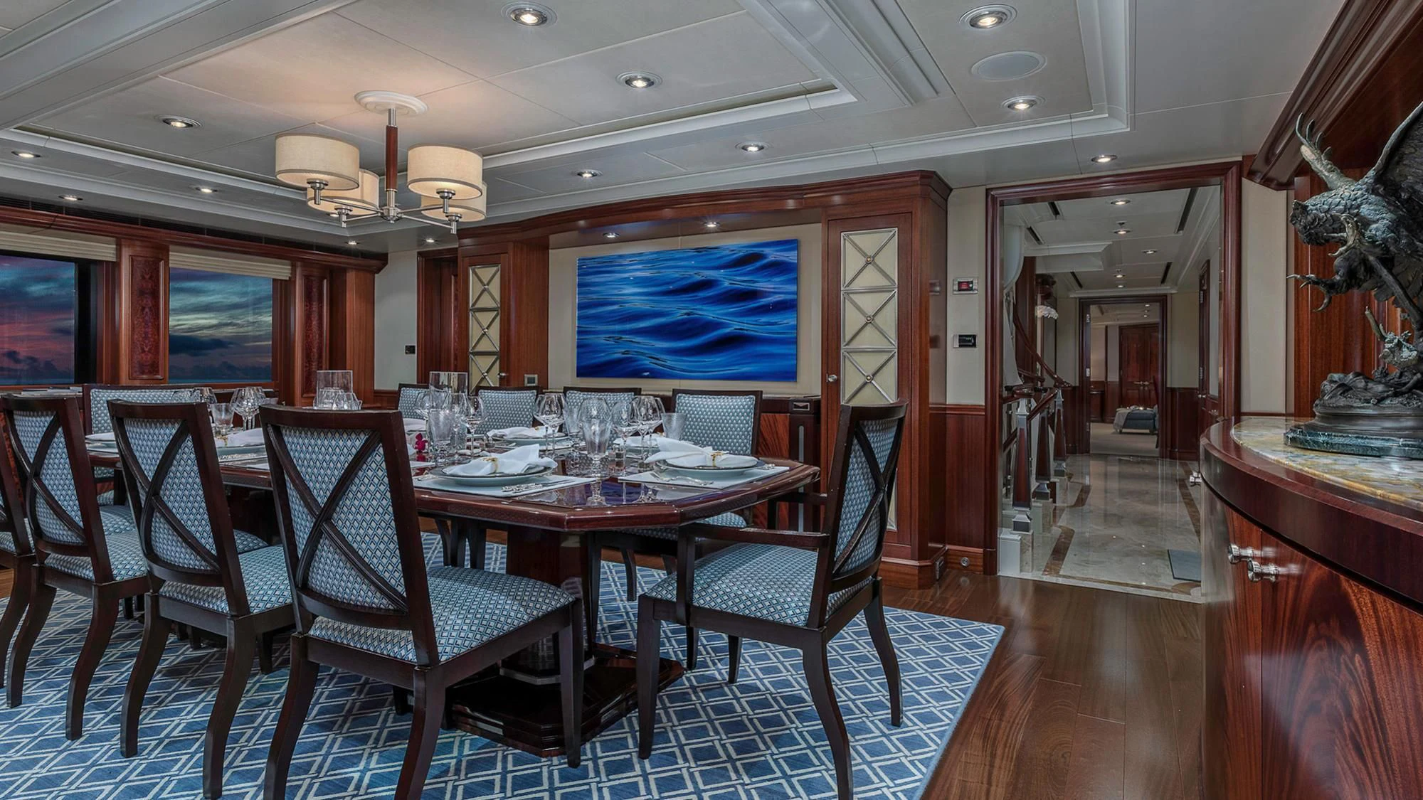 a dining room with a table and chairs aboard AVALON Yacht for Sale