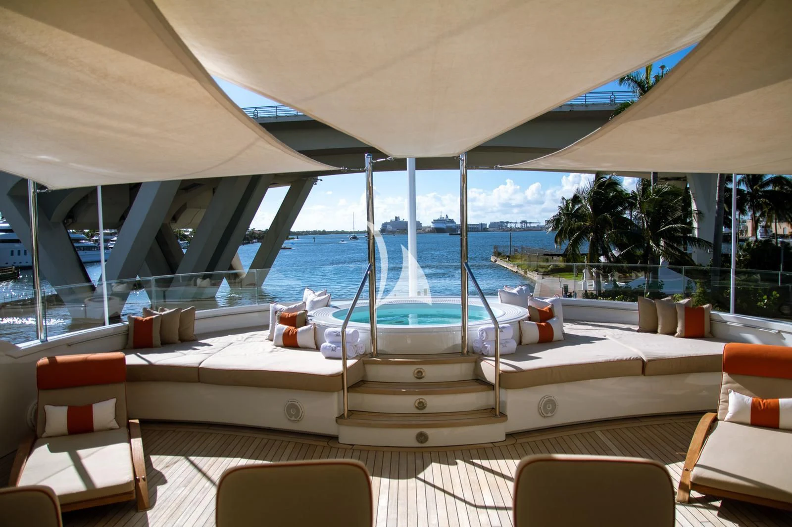 a room with a pool and lounge chairs and a large window aboard AVALON Yacht for Sale
