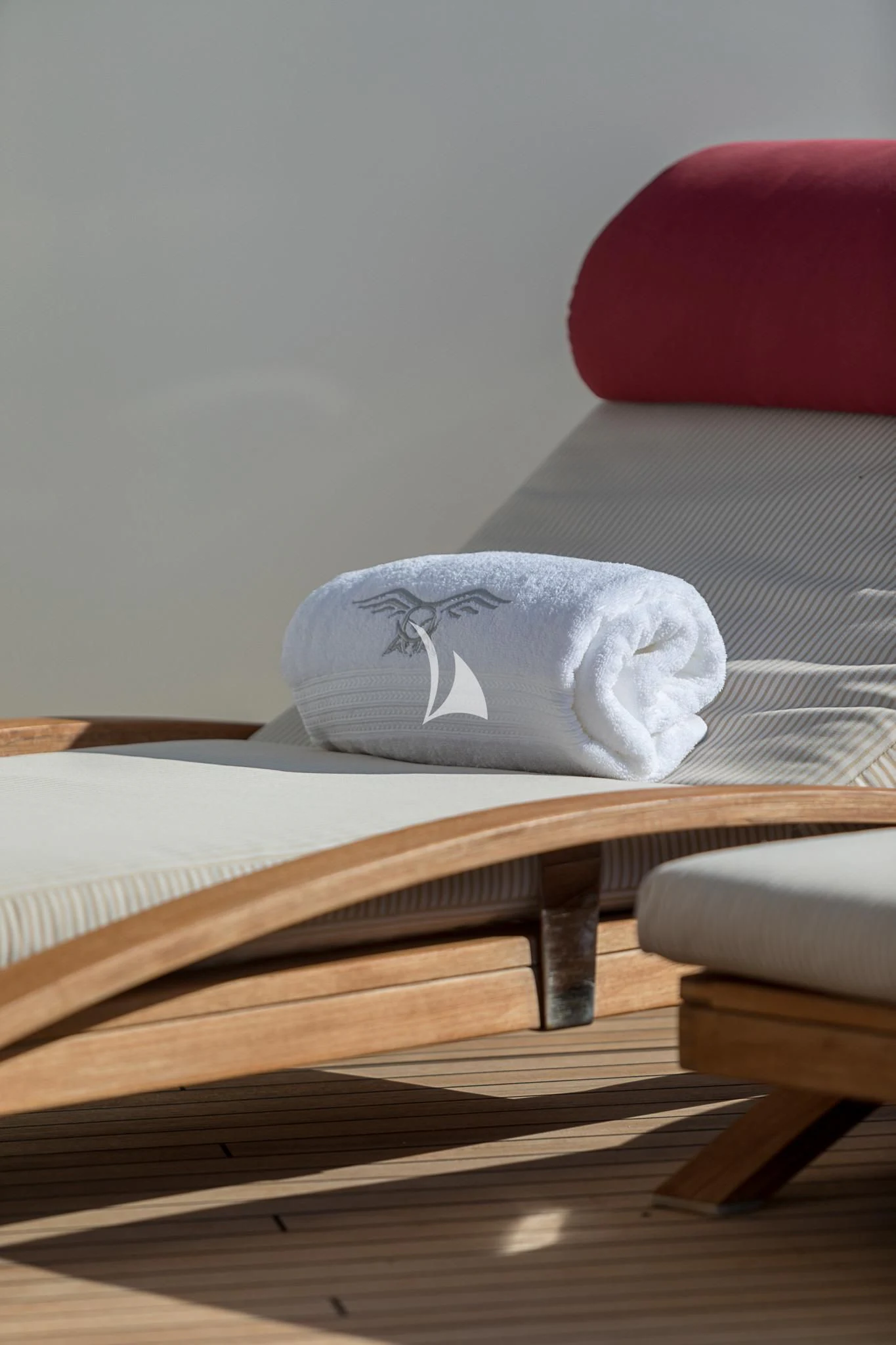a white pillow on a table aboard AVALON Yacht for Sale