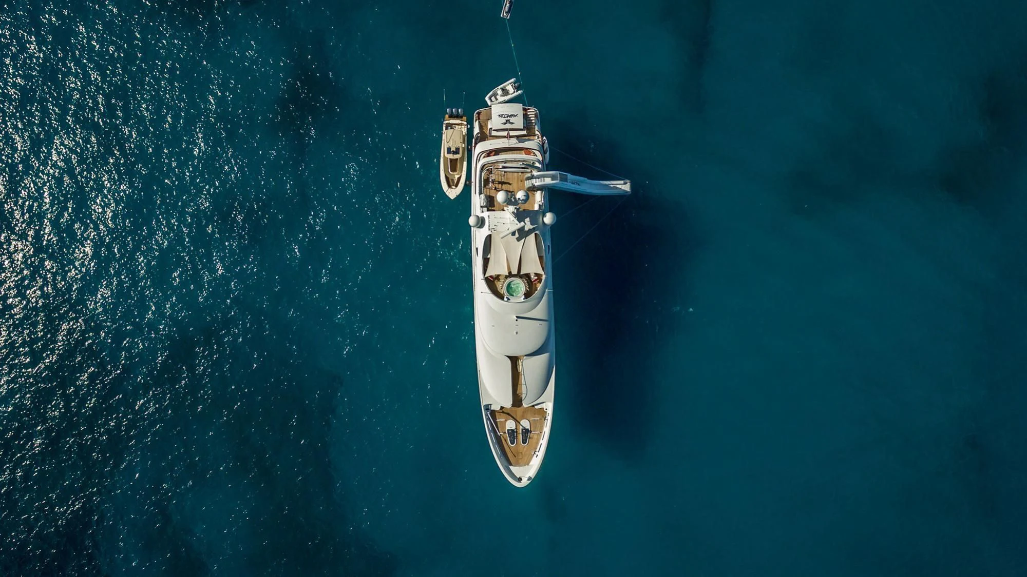 a white and black boat aboard AVALON Yacht for Sale