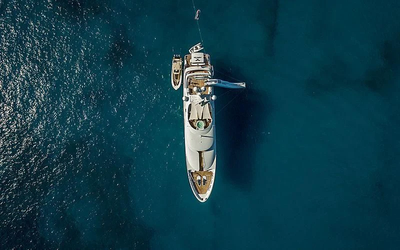 a space shuttle flying over a planet aboard AVALON Yacht for Sale