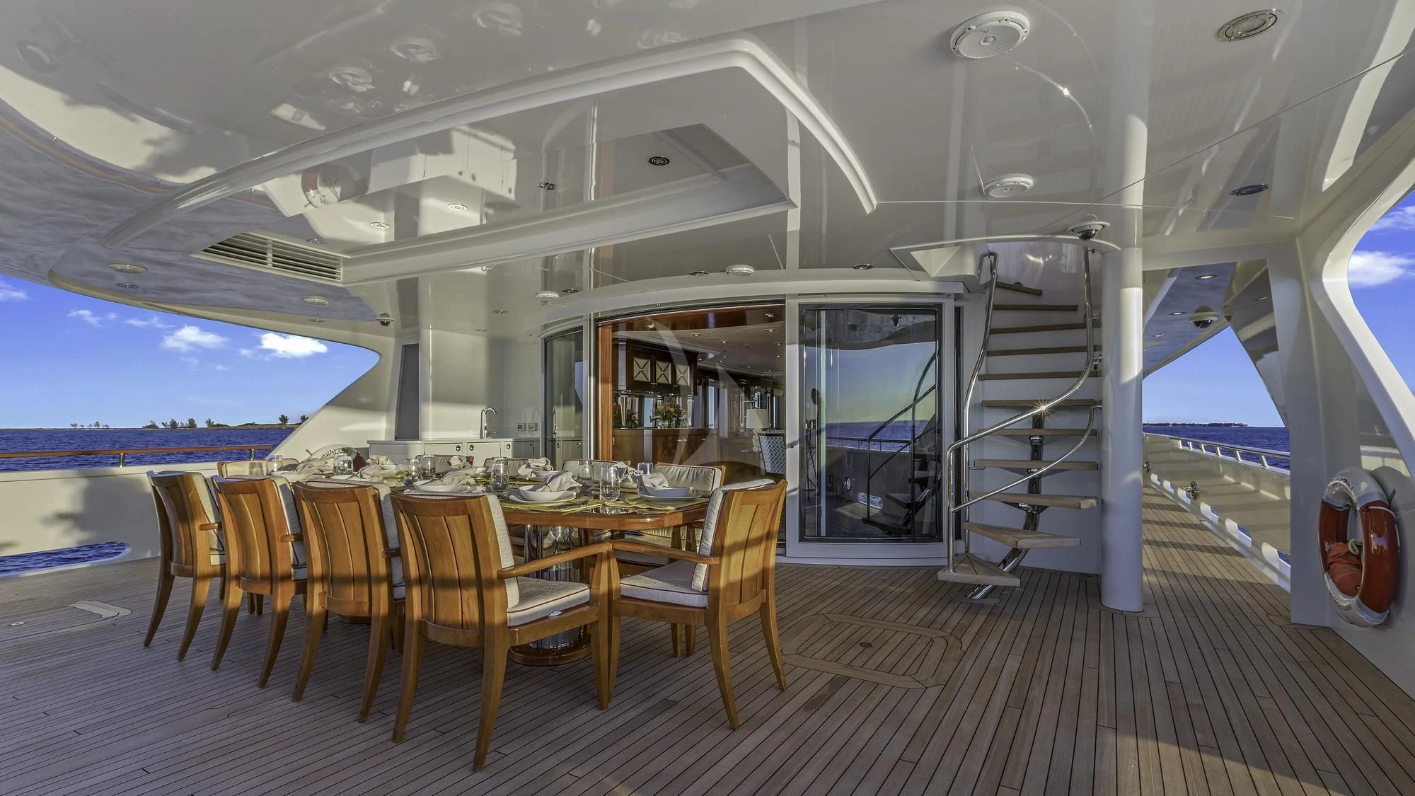 a room with a table and chairs aboard AVALON Yacht for Sale