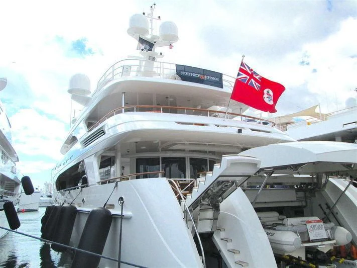 a large ship with a flag on the front aboard AVALON Yacht for Sale