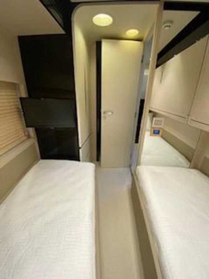 a bathroom with a bathtub and sinks aboard FORTUNA Yacht for Sale