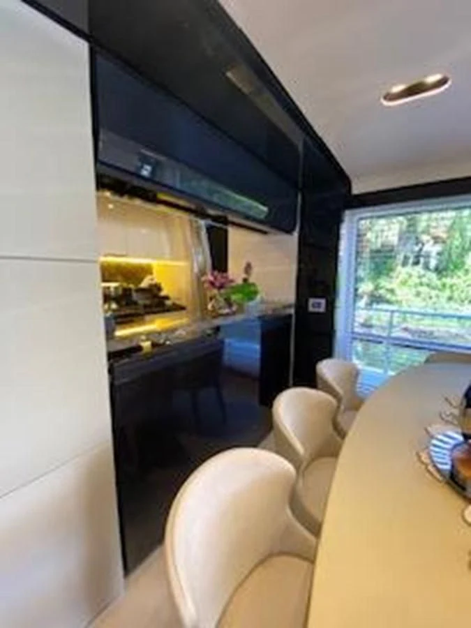 a kitchen with a large tv aboard FORTUNA Yacht for Sale