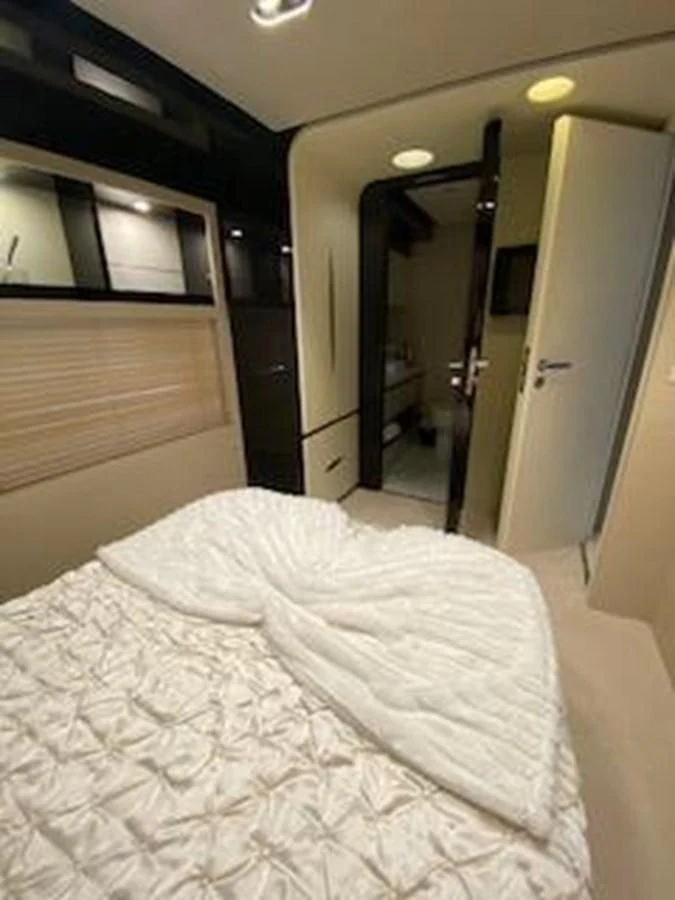 a bed in a room aboard FORTUNA Yacht for Sale