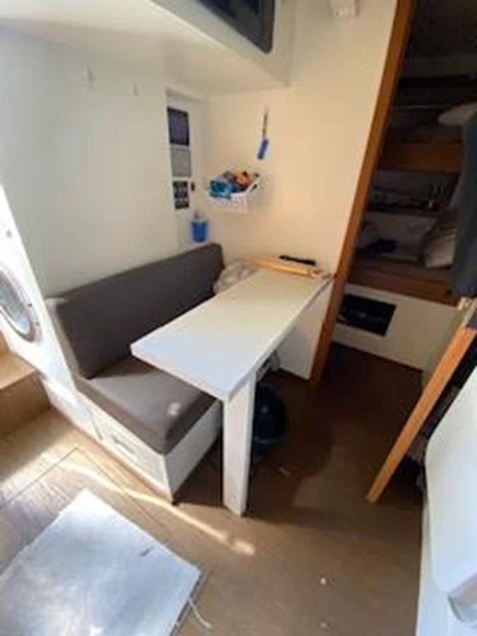a room with a table and a chair aboard FORTUNA Yacht for Sale