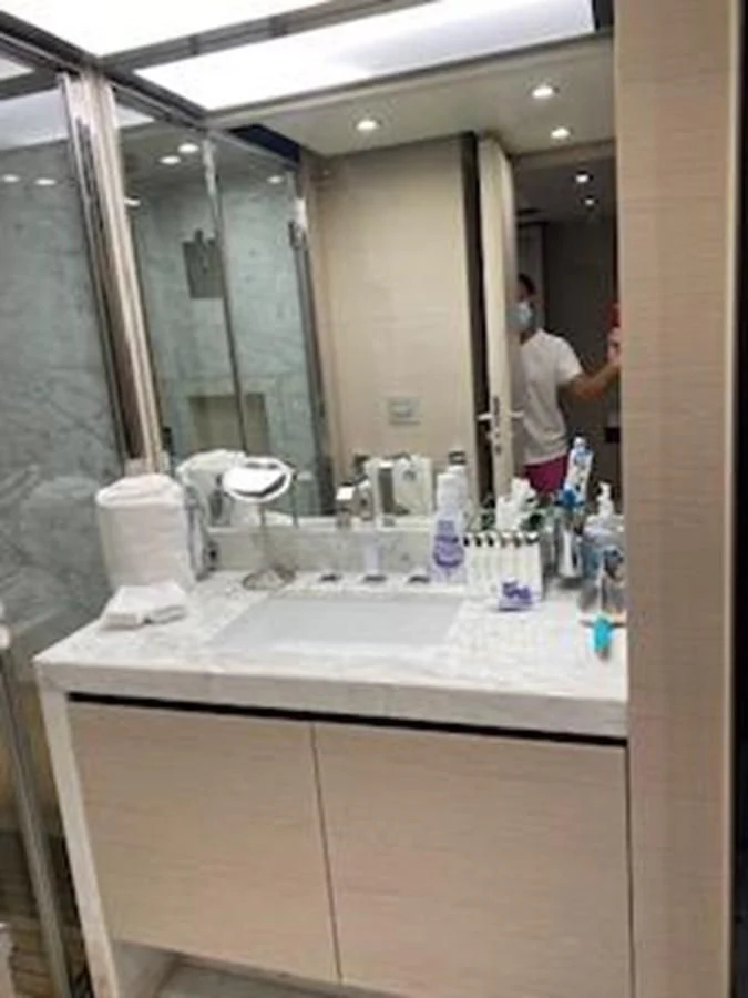 a bathroom with a large mirror aboard FORTUNA Yacht for Sale