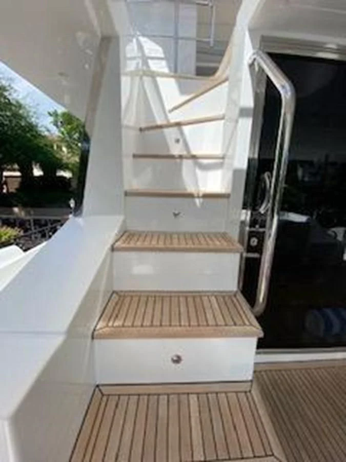 a staircase with glass doors aboard FORTUNA Yacht for Sale