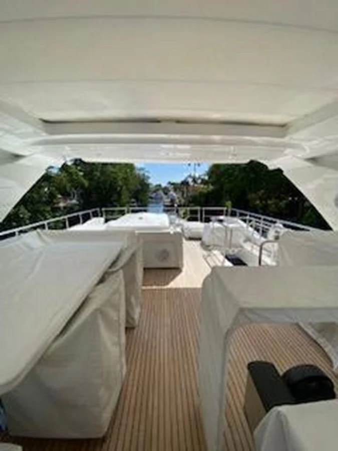 a room with a view of the water and a large crowd of people aboard FORTUNA Yacht for Sale