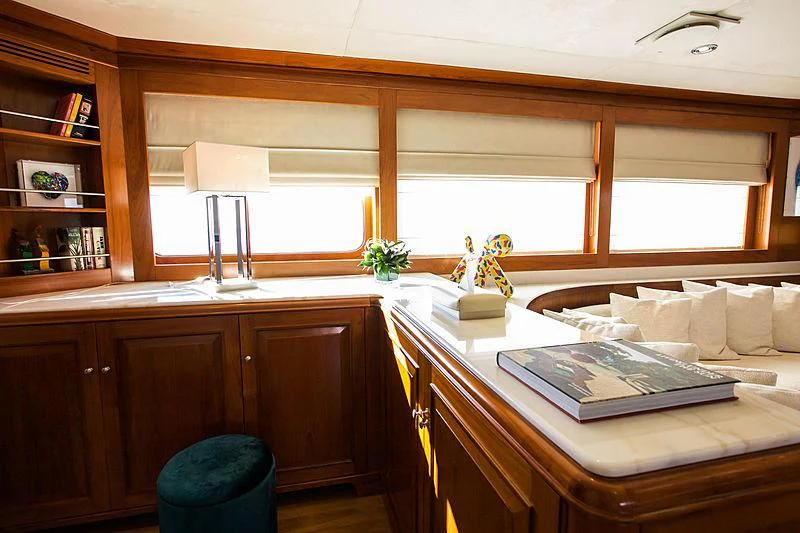 a room with a desk and a window aboard MASQUENADA Yacht for Sale