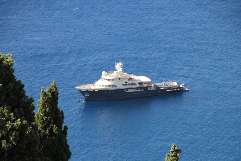 a large ship in the water aboard MASQUENADA Yacht for Sale