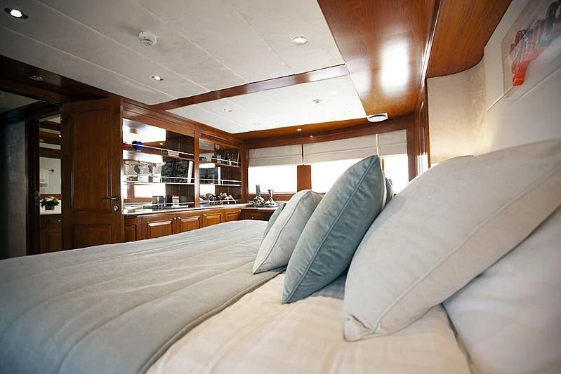 a bed in a room aboard MASQUENADA Yacht for Sale