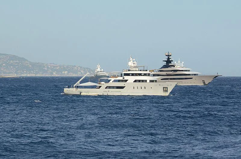 a large white ship in the water aboard MASQUENADA Yacht for Sale