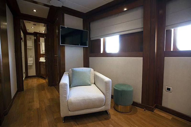 a living room with a couch aboard MASQUENADA Yacht for Sale