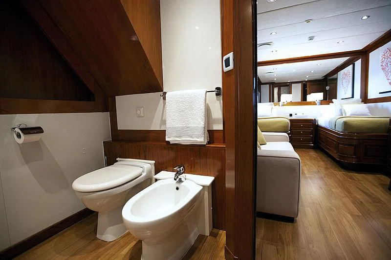 a bathroom with a sink and a toilet aboard MASQUENADA Yacht for Sale