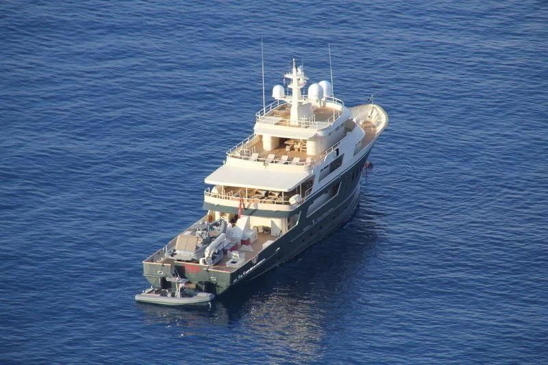 a large ship in the water aboard MASQUENADA Yacht for Sale