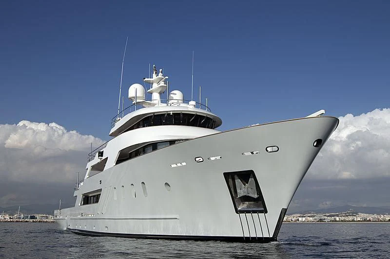 a large white ship on the water aboard MASQUENADA Yacht for Sale