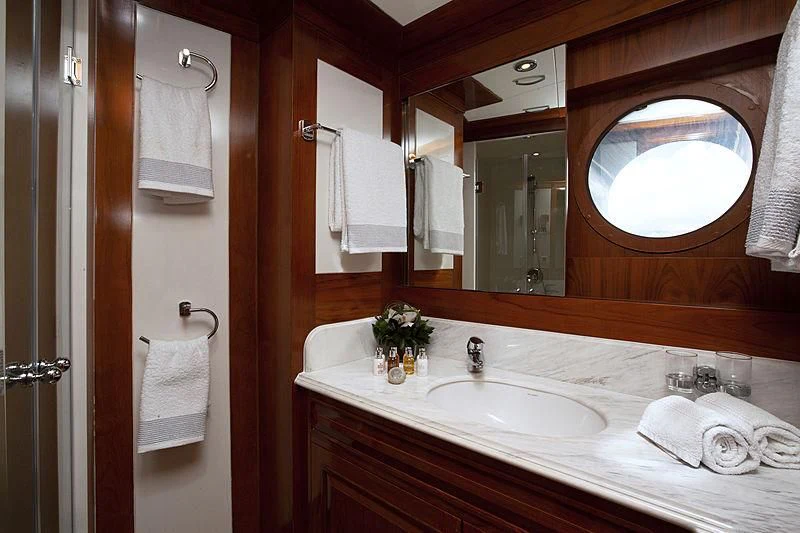 a bathroom with a large mirror aboard MASQUENADA Yacht for Sale