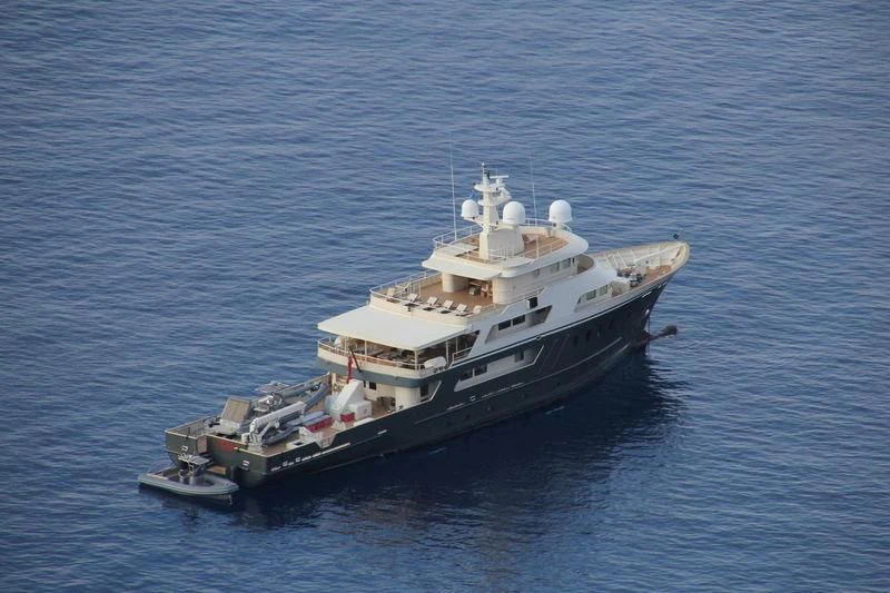 a large ship in the water aboard MASQUENADA Yacht for Sale