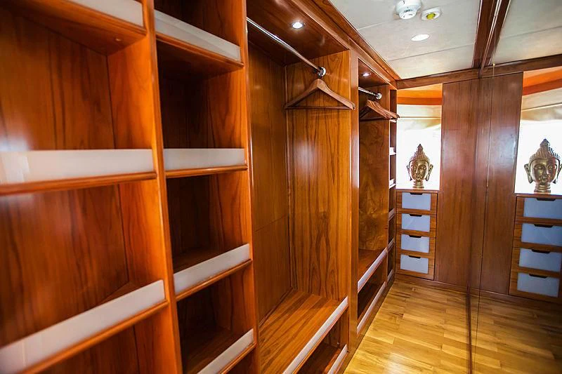 a room with wooden cabinets aboard MASQUENADA Yacht for Sale