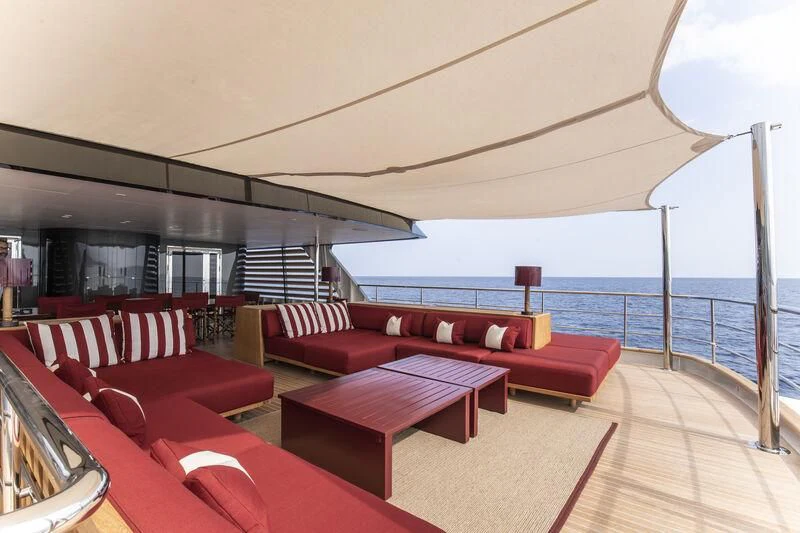 a room with a large balcony aboard MASQUENADA Yacht for Sale