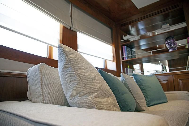 a couch with pillows aboard MASQUENADA Yacht for Sale