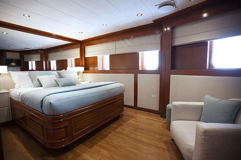 a bed in a room aboard MASQUENADA Yacht for Sale