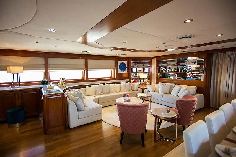 a living room with a large window aboard MASQUENADA Yacht for Sale