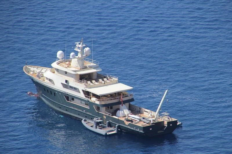 a large ship in the water aboard MASQUENADA Yacht for Sale