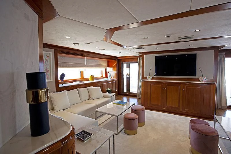 a living room with a large tv aboard MASQUENADA Yacht for Sale
