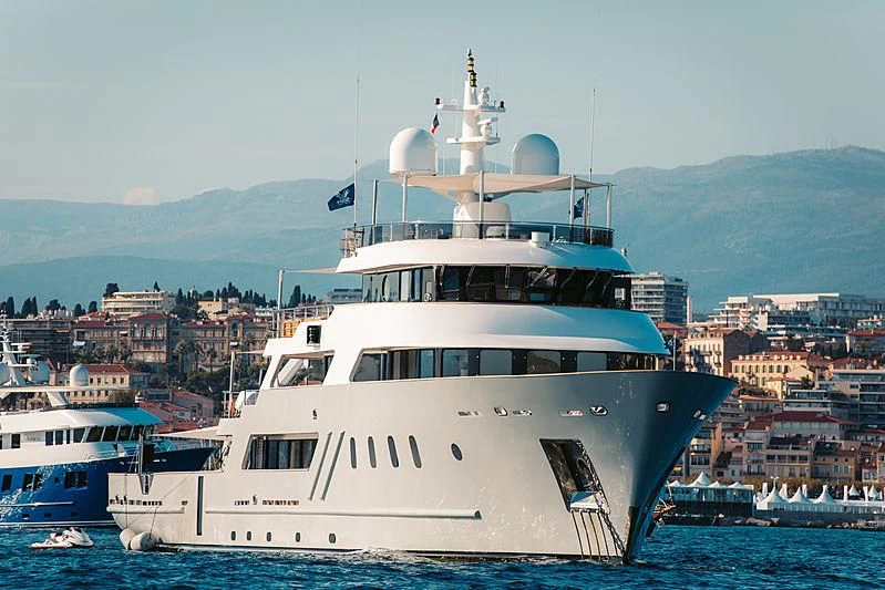 a large white boat in the water aboard MASQUENADA Yacht for Sale