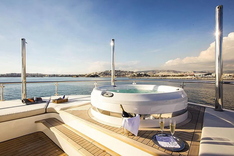 a boat on a deck aboard MASQUENADA Yacht for Sale