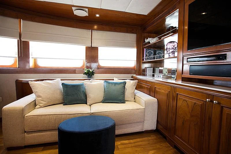 a living room with a couch aboard MASQUENADA Yacht for Sale