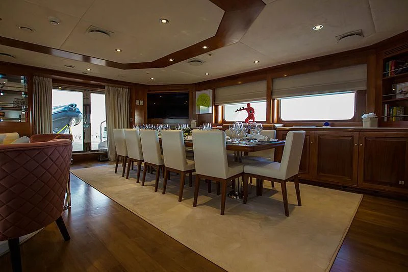a large kitchen and dining room area aboard MASQUENADA Yacht for Sale