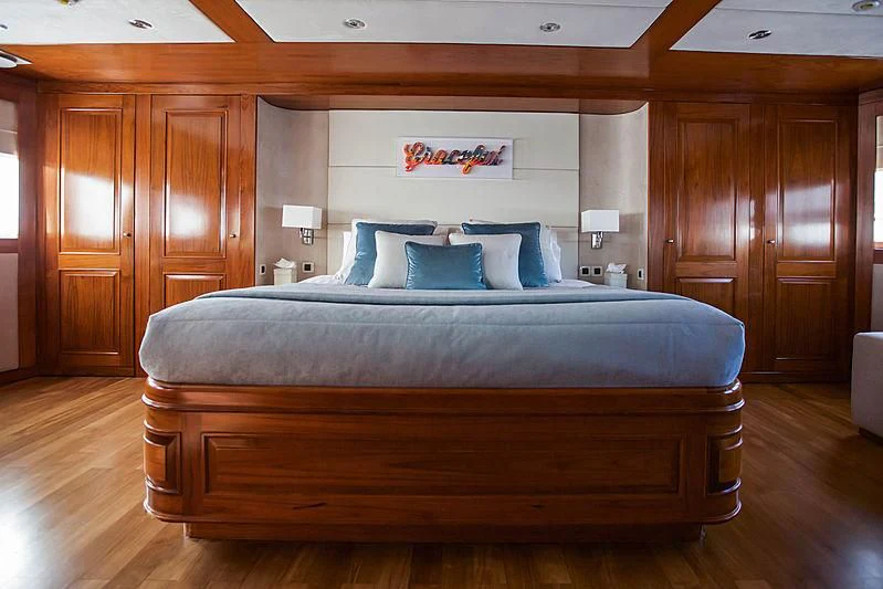 a bed in a room aboard MASQUENADA Yacht for Sale