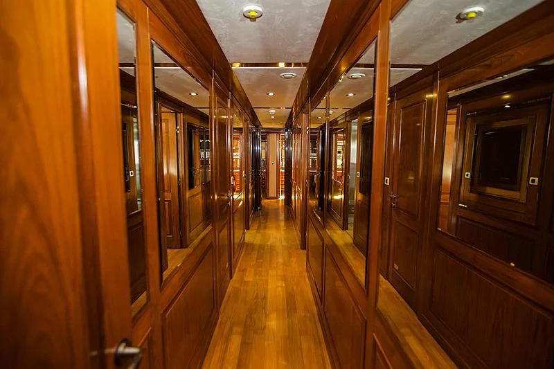 a hallway with wood floors aboard MASQUENADA Yacht for Sale