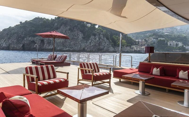 a room with a table and chairs aboard MASQUENADA Yacht for Sale