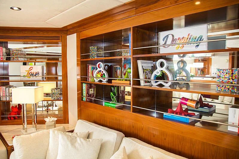 a room with shelves and a couch aboard MASQUENADA Yacht for Sale
