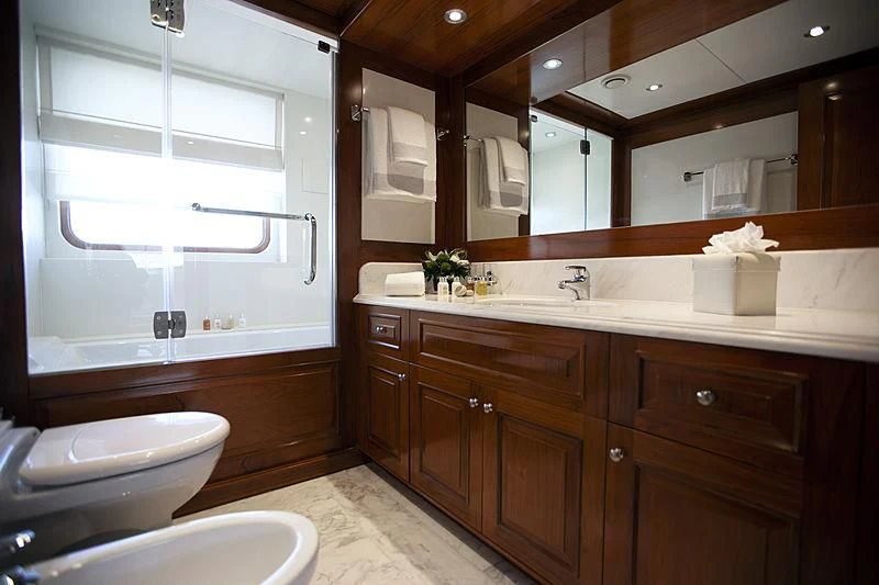 a bathroom with a large mirror aboard MASQUENADA Yacht for Sale