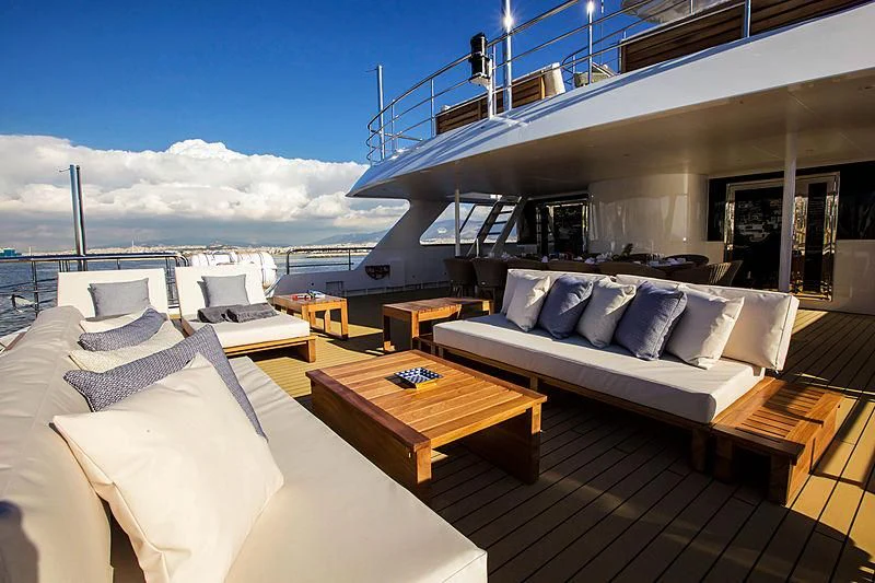 a bed and a table on a boat aboard MASQUENADA Yacht for Sale