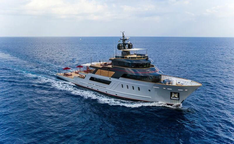 a large ship in the water aboard MASQUENADA Yacht for Sale