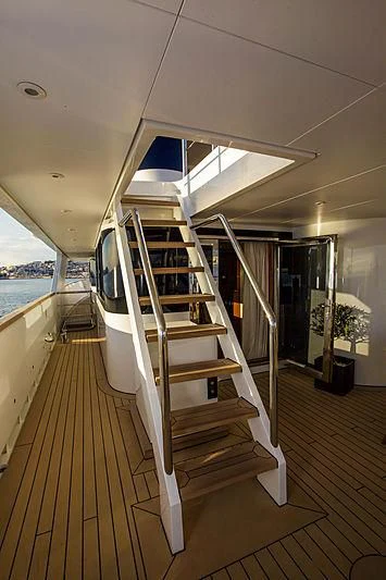 a white staircase in a room aboard MASQUENADA Yacht for Sale