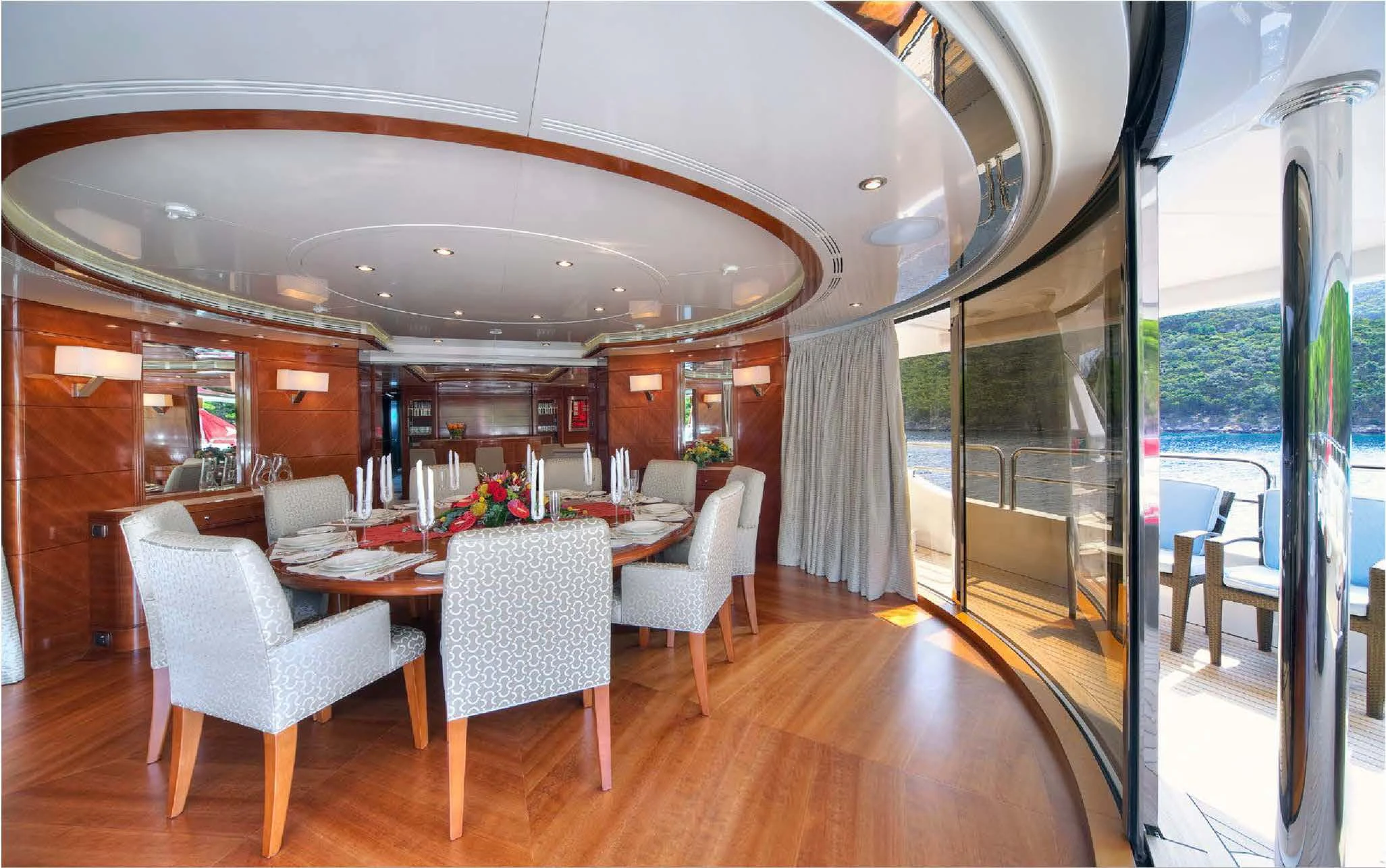 a dining room with a large window aboard EVERBLUE Yacht for Sale