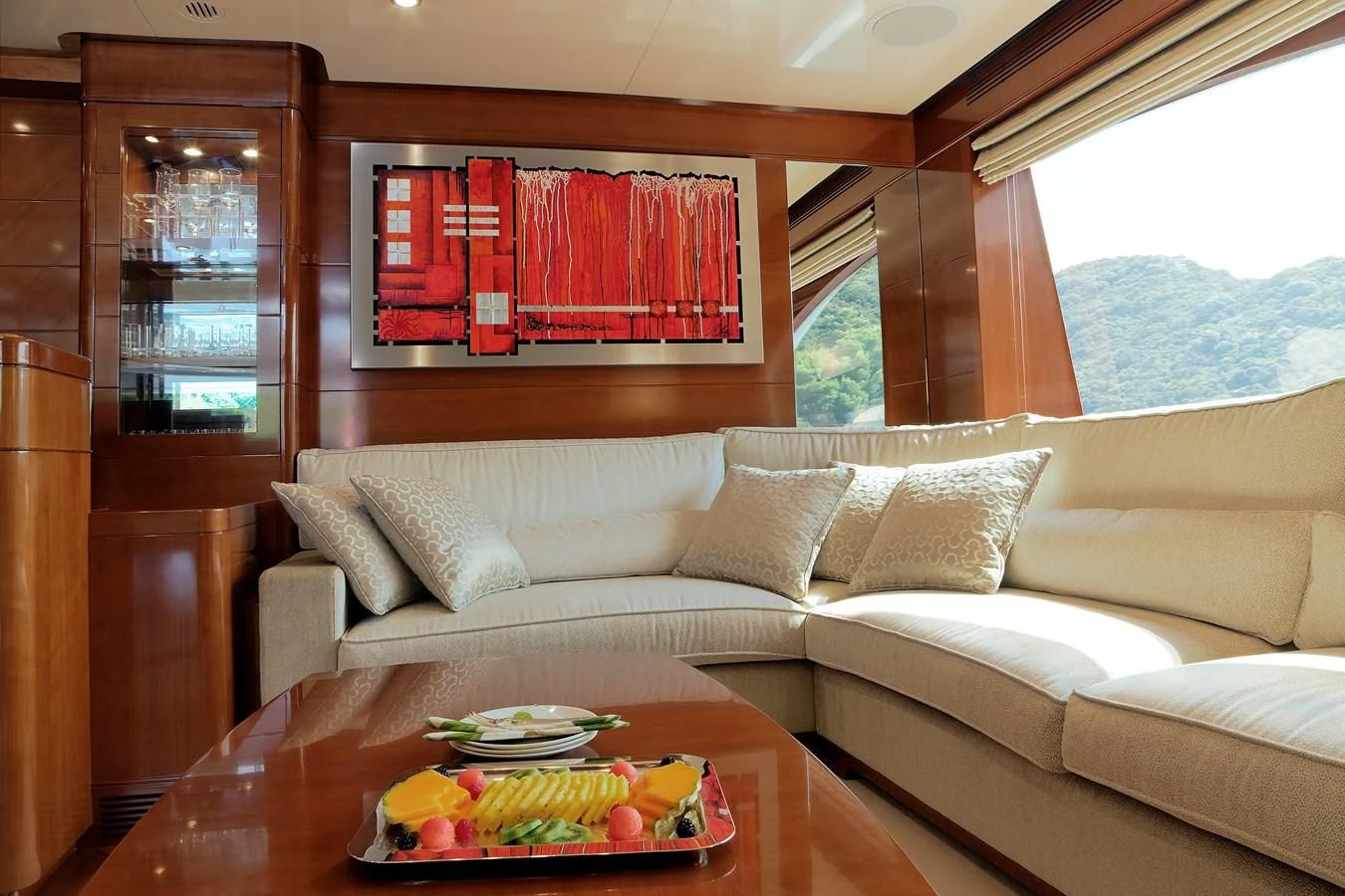 a living room with a couch and a table aboard EVERBLUE Yacht for Sale